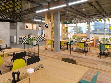 Modernes Café mit bunten Stühlen und grossen Fenstern.