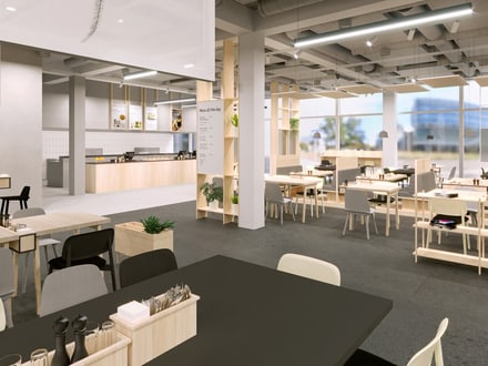 Moderne Cafeteria mit Sitzgelegenheiten und Pflanzen.