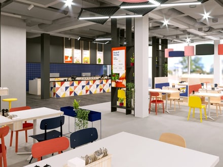 Modernes, buntes Restaurant mit Tischen und Stühlen.