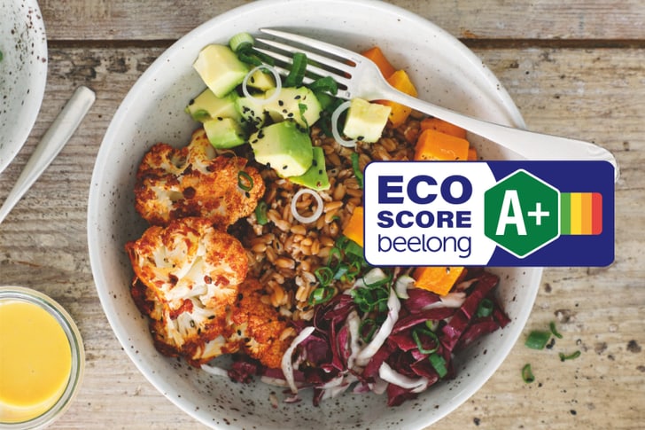 Schüssel mit Salat, Gemüsen und Eco Score A+ Logo.
