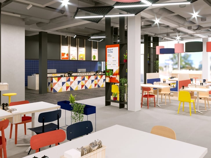 Modernes, buntes Restaurant mit Tischen und Stühlen.