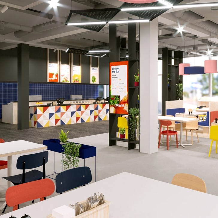 Modernes, buntes Restaurant mit Tischen und Stühlen.