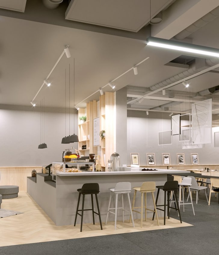 Modernes Café-Interieur mit Barbereich und Tischen.