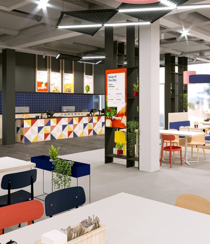 Modernes, buntes Restaurant mit Tischen und Stühlen.