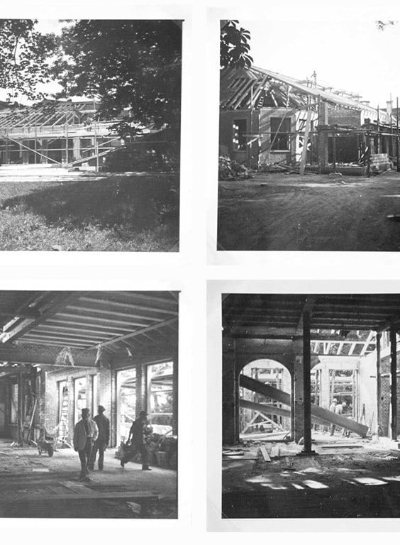 Vier Schwarzweissbilder von Gebäuderenovierungen.