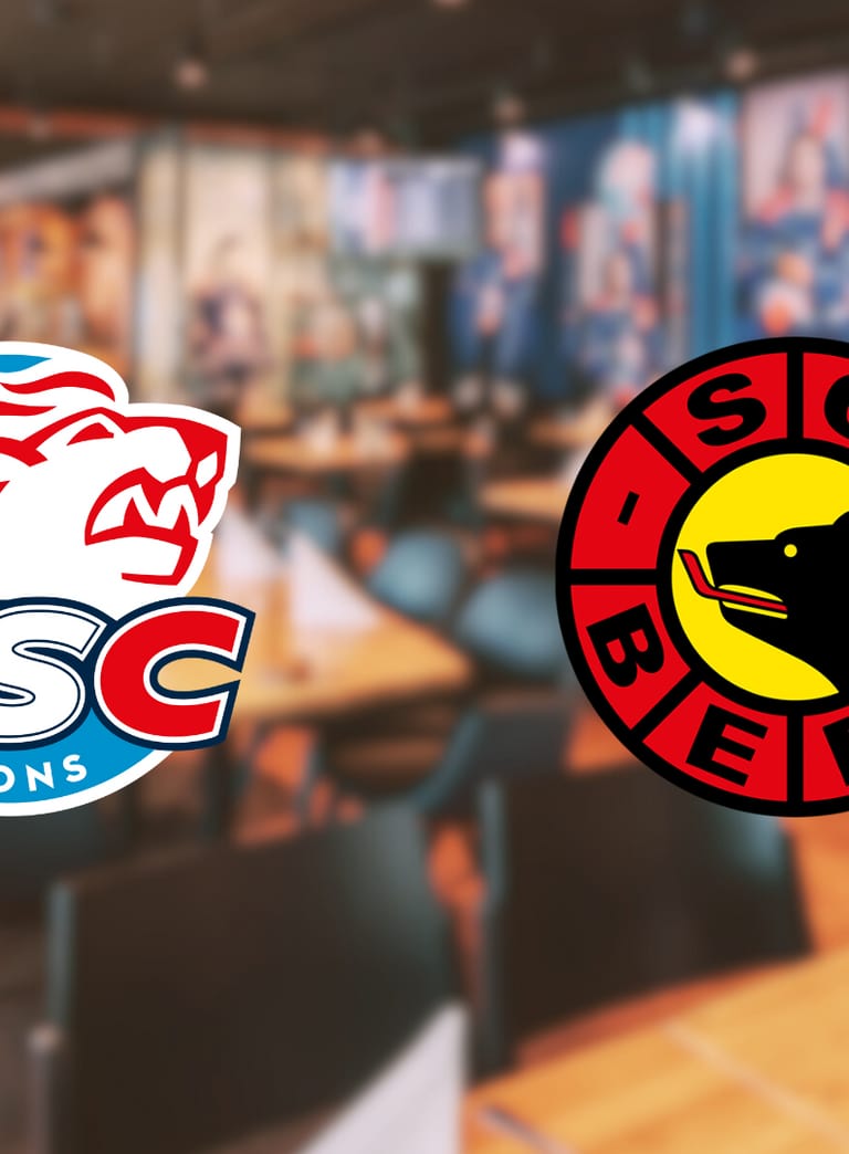 Logos von ZSC Lions und SC Bern in einem Restaurant-Hintergrund.