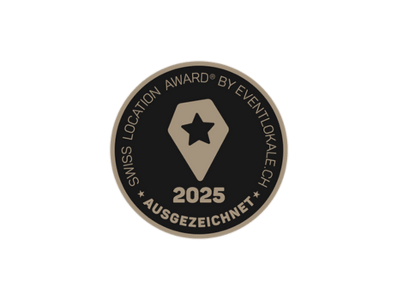 Swiss Location Award 2025 Emblem in Schwarz und Gold.