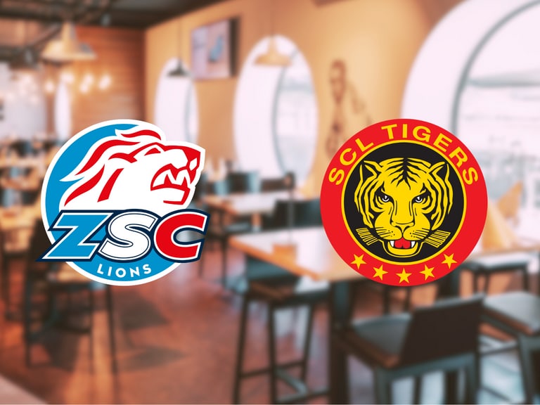 Restaurantinneneinrichtung mit zwei Sportlogos.